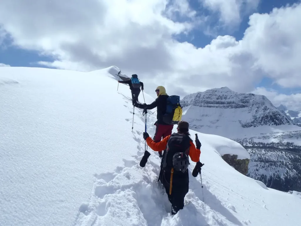 Ski mountaineers on submit ridge