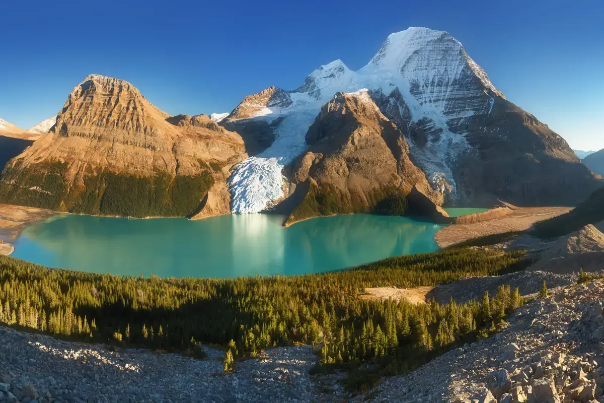 Canada, British Columbia. Mount Robson, highest mountain in the Canadian Rockies, elevation 3,954 m (12,972 ft), seen from Mumm Basin, Mount Robson Provincial Park. Summer time